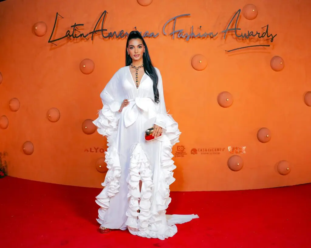 A woman posing on the Latin American Fashion Awards Red Carpet at our Caribbean wellness resort