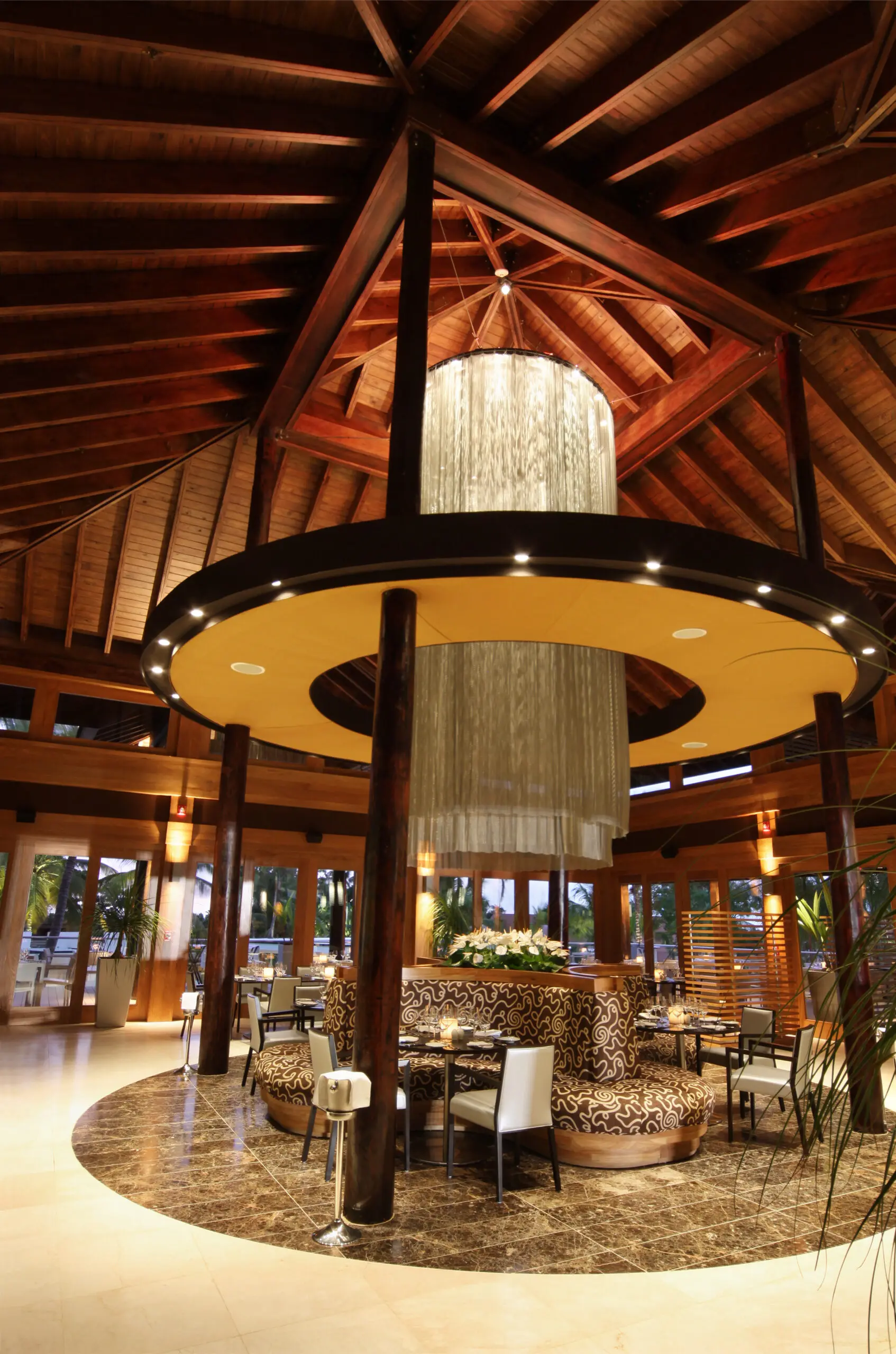 Gorgeous chandelier hanging over tables at La Caña Bar &amp; Restaurant