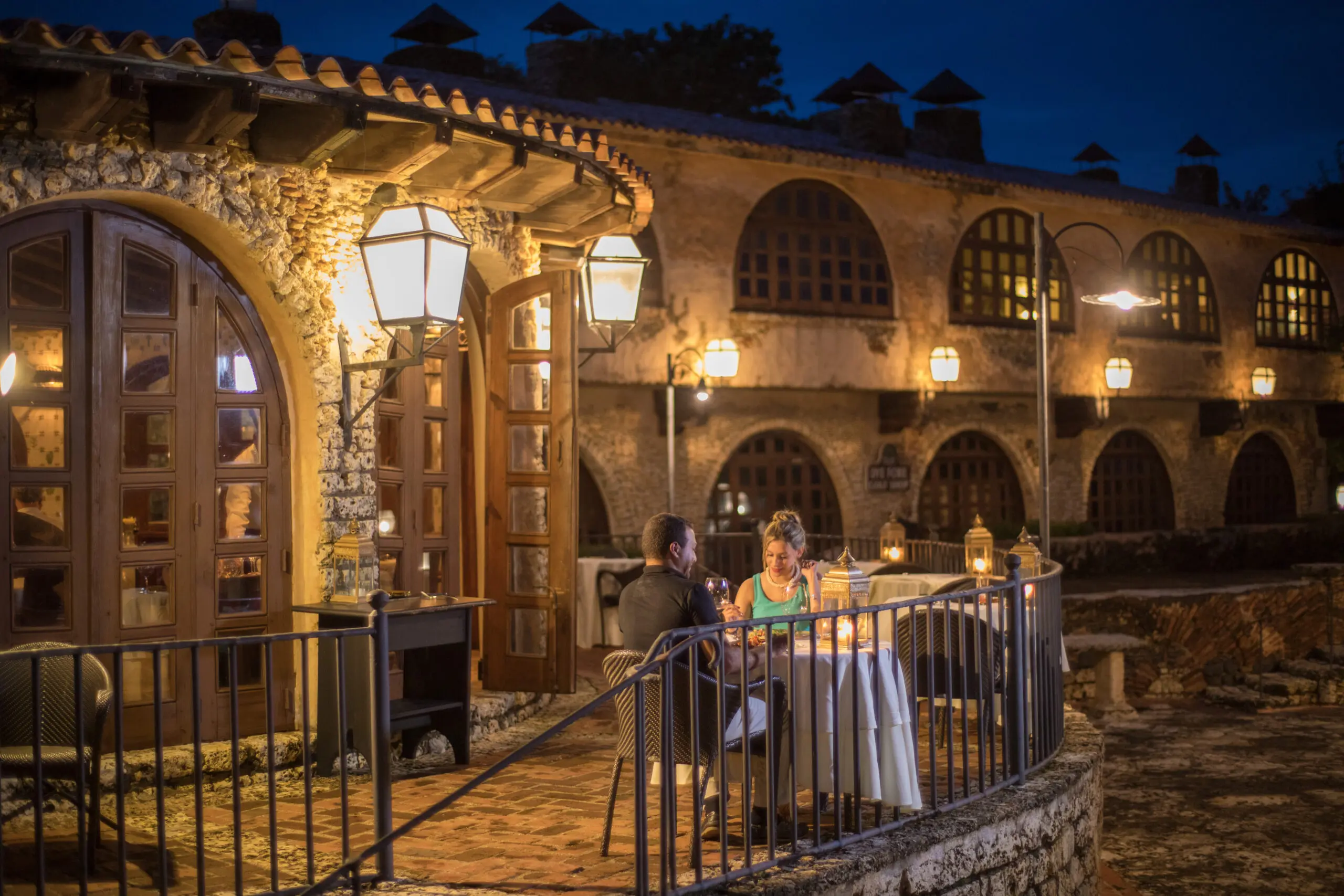 Couple dining on the patio at La Piazzetta restaurant in the Dominican Republic