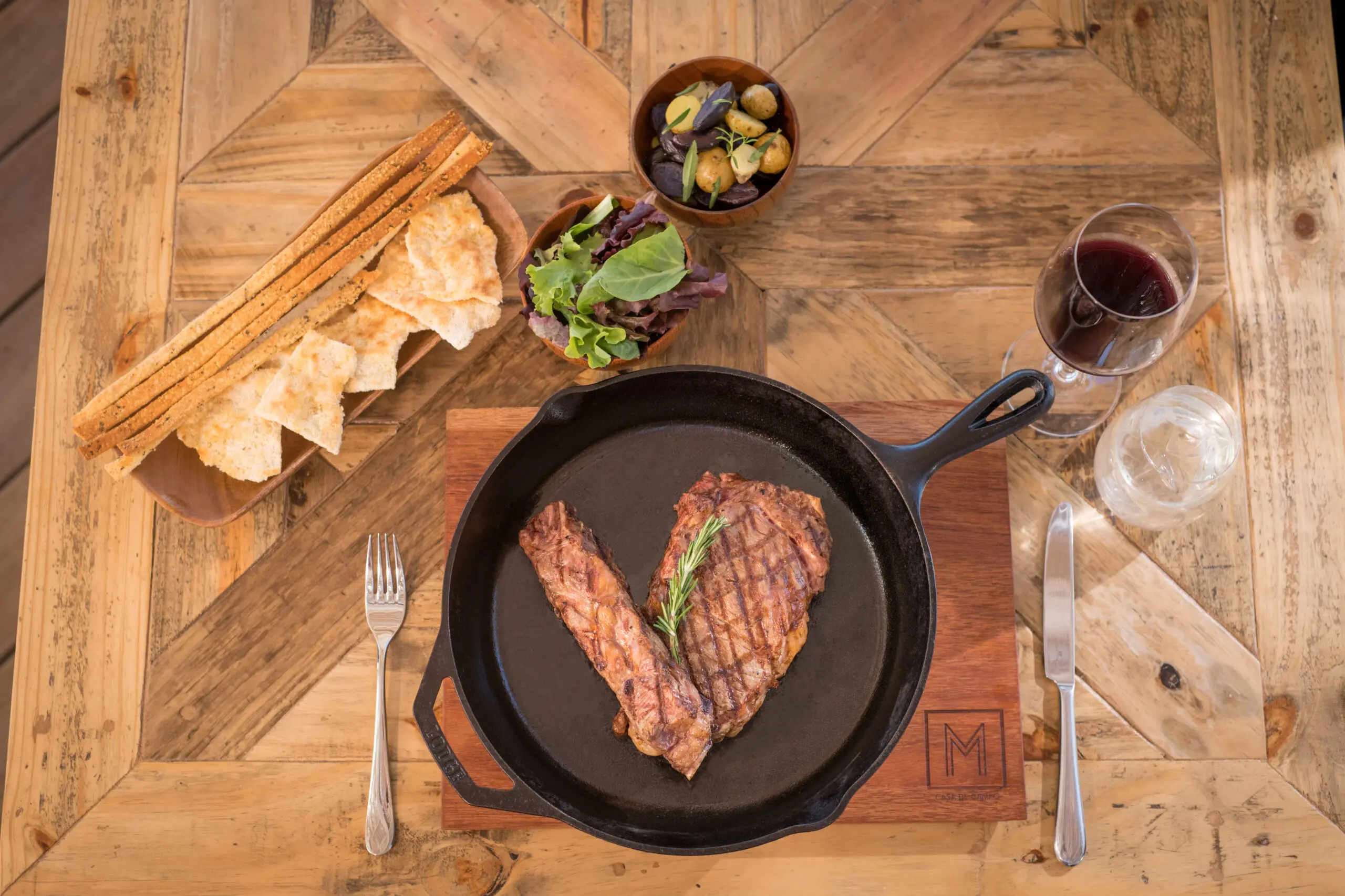 An elegant steak and seafood meal served at Minitas Beach Club & Restaurant