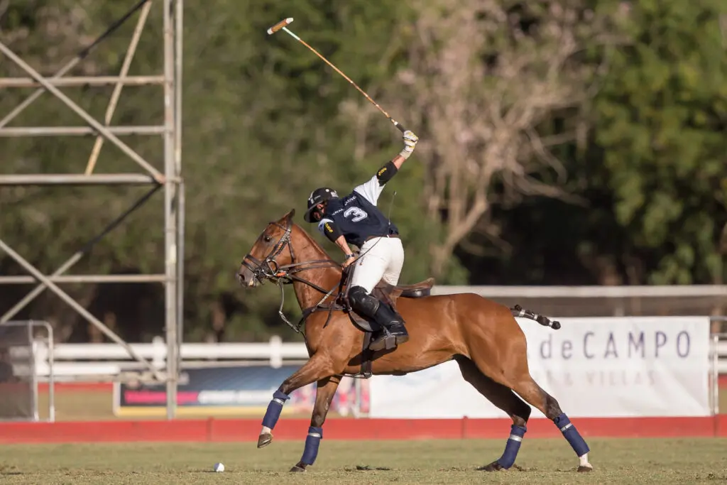 A polo player during a match at our luxury resort in the Dominican Republic