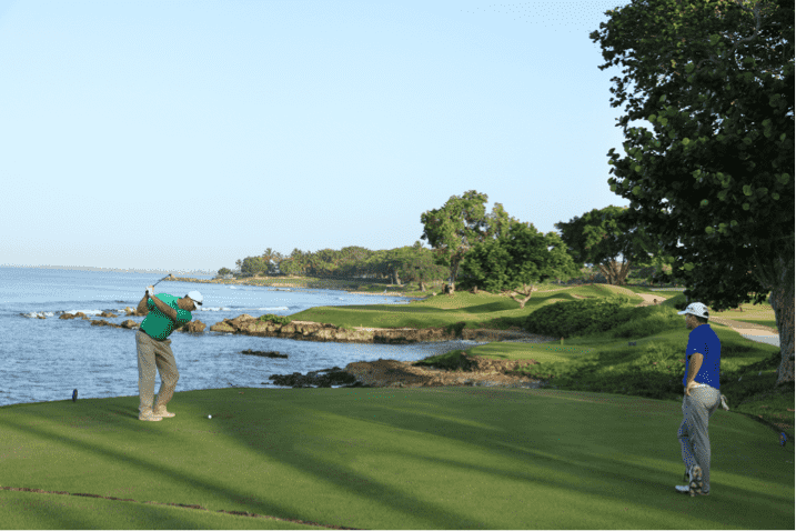 A golfer tees off at Teeth of the Dog® in the Dominican Republic. 