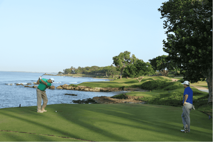 A golfer tees off at Teeth of the Dog®  in the Dominican Republic.