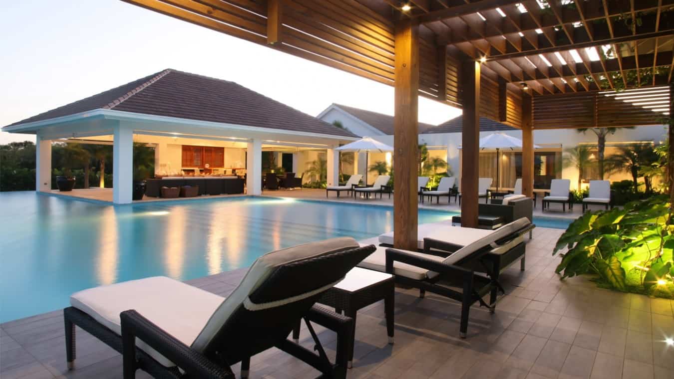 Outdoor entertainment area and pool at a Casa de Campo Villa