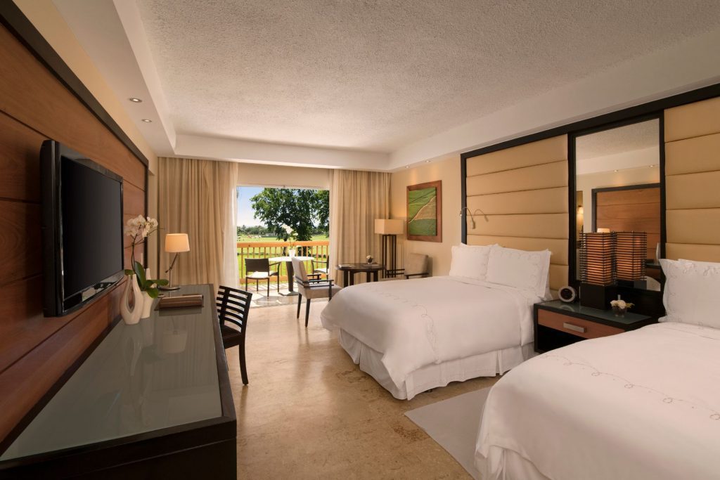 Elite Dominican Republic Resort Hotel Suite With Double Beds and Patio at Casa de Campo Resort & Villas.