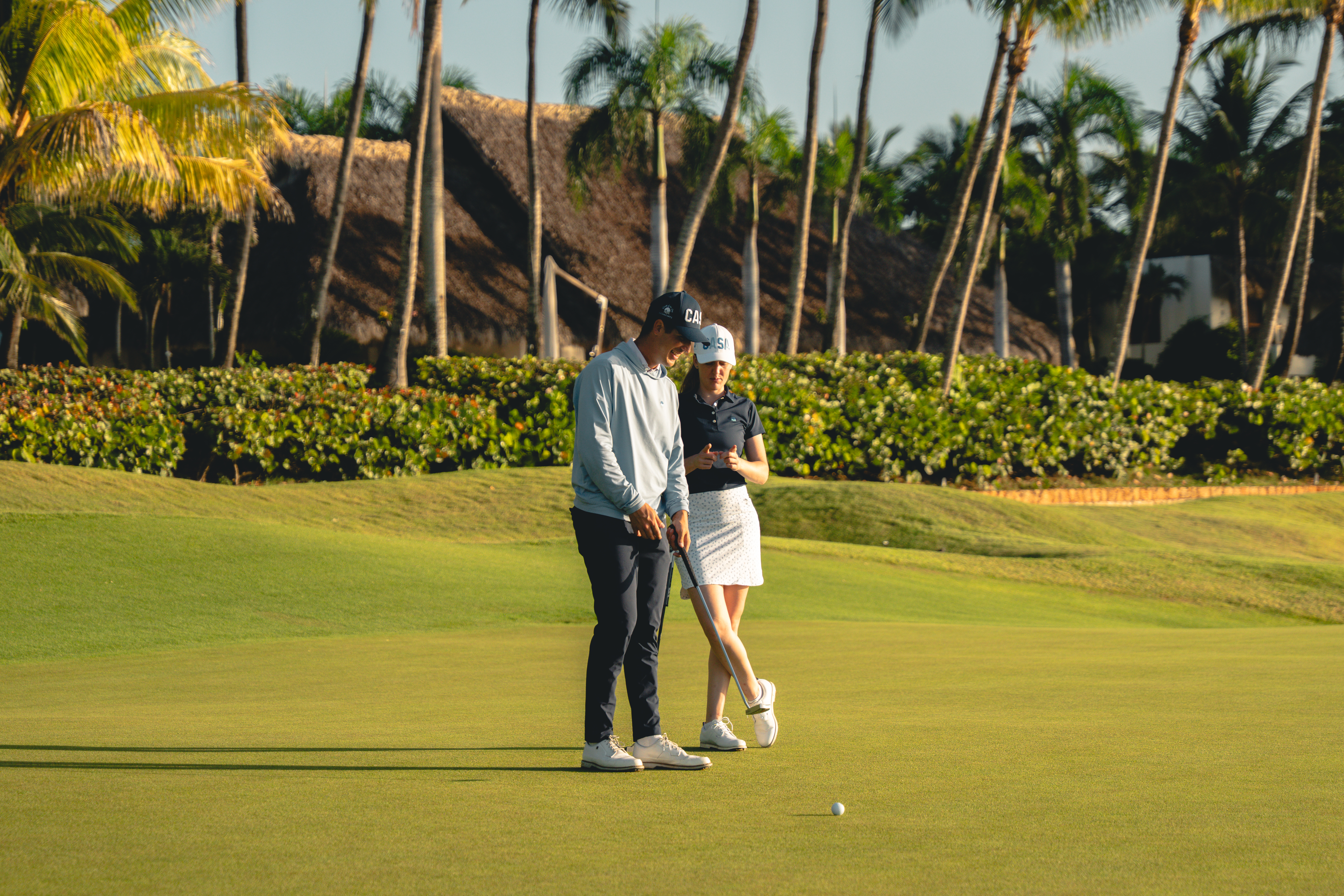 Couple playing golf at Teeth of the Dog