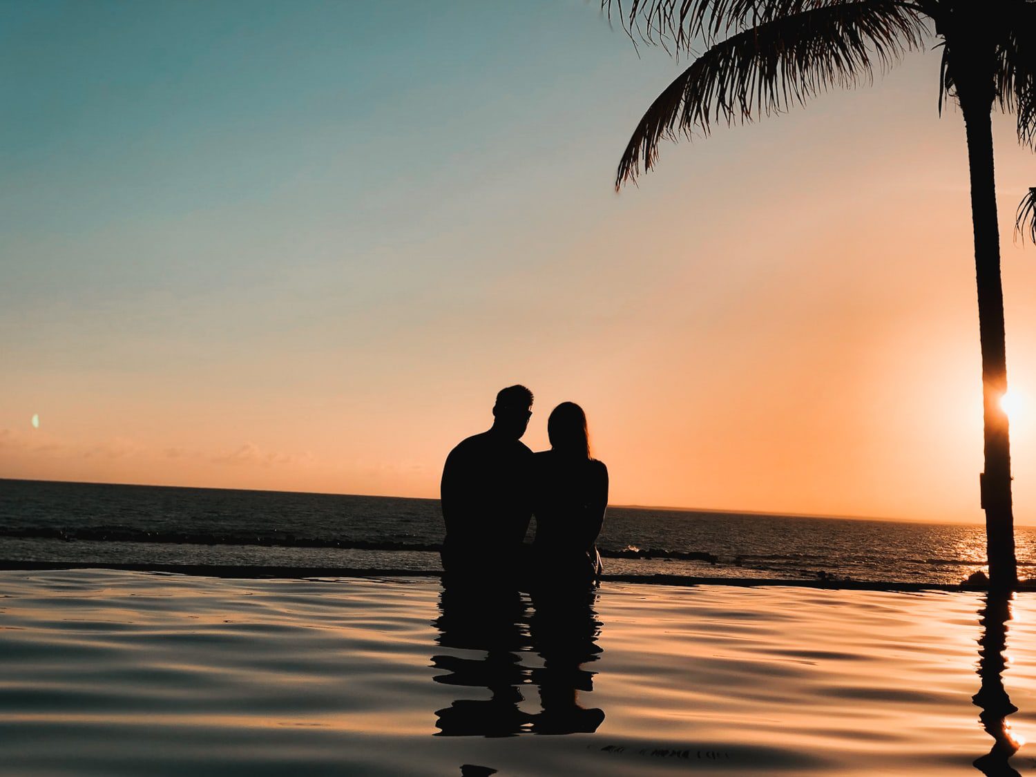 Couple enjoying a romantic view from the Minitas Infinity Pool