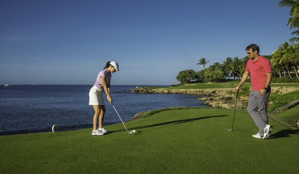 Couple playing golf at Teeth of the Dog