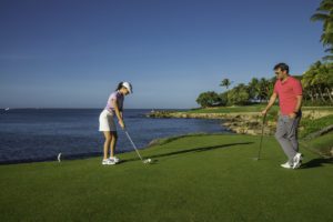 Couple playing golf at Teeth of the Dog