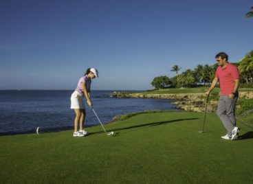 Couple playing golf at Teeth of the Dog