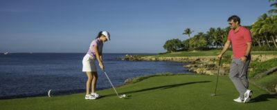 Couple playing golf at Teeth of the Dog