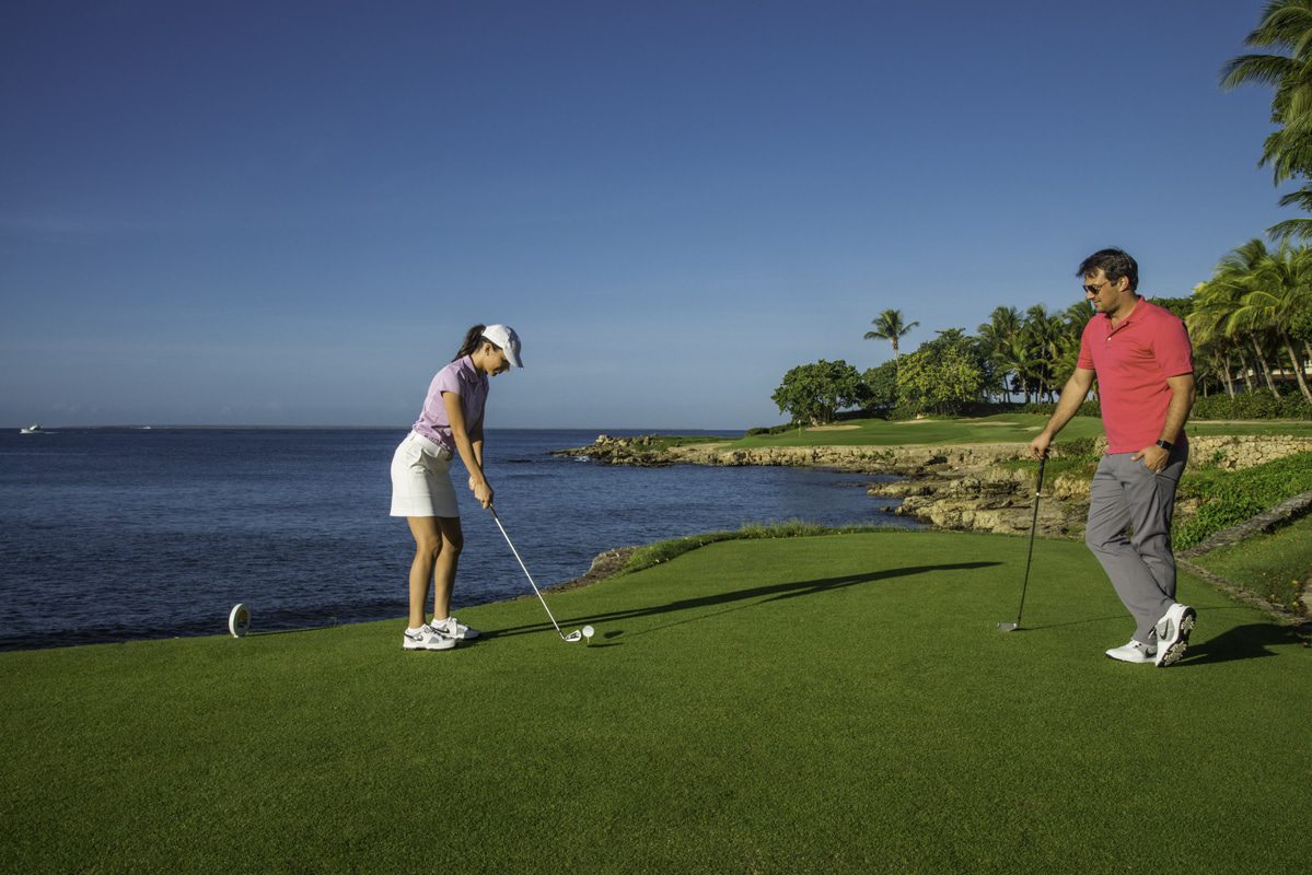 Couple playing golf at Teeth of the Dog