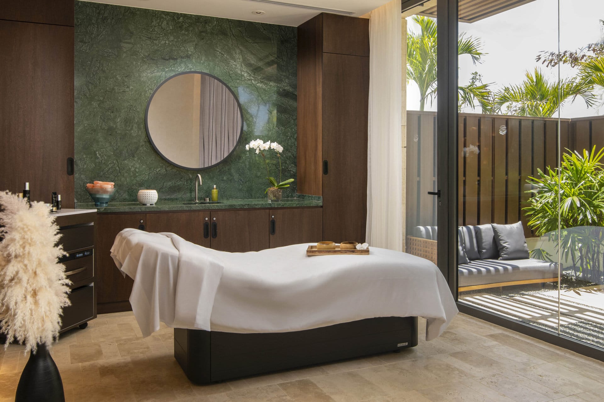 A relaxing spa room with an outdoor zen patio at Casa de Campo Resort and Villas