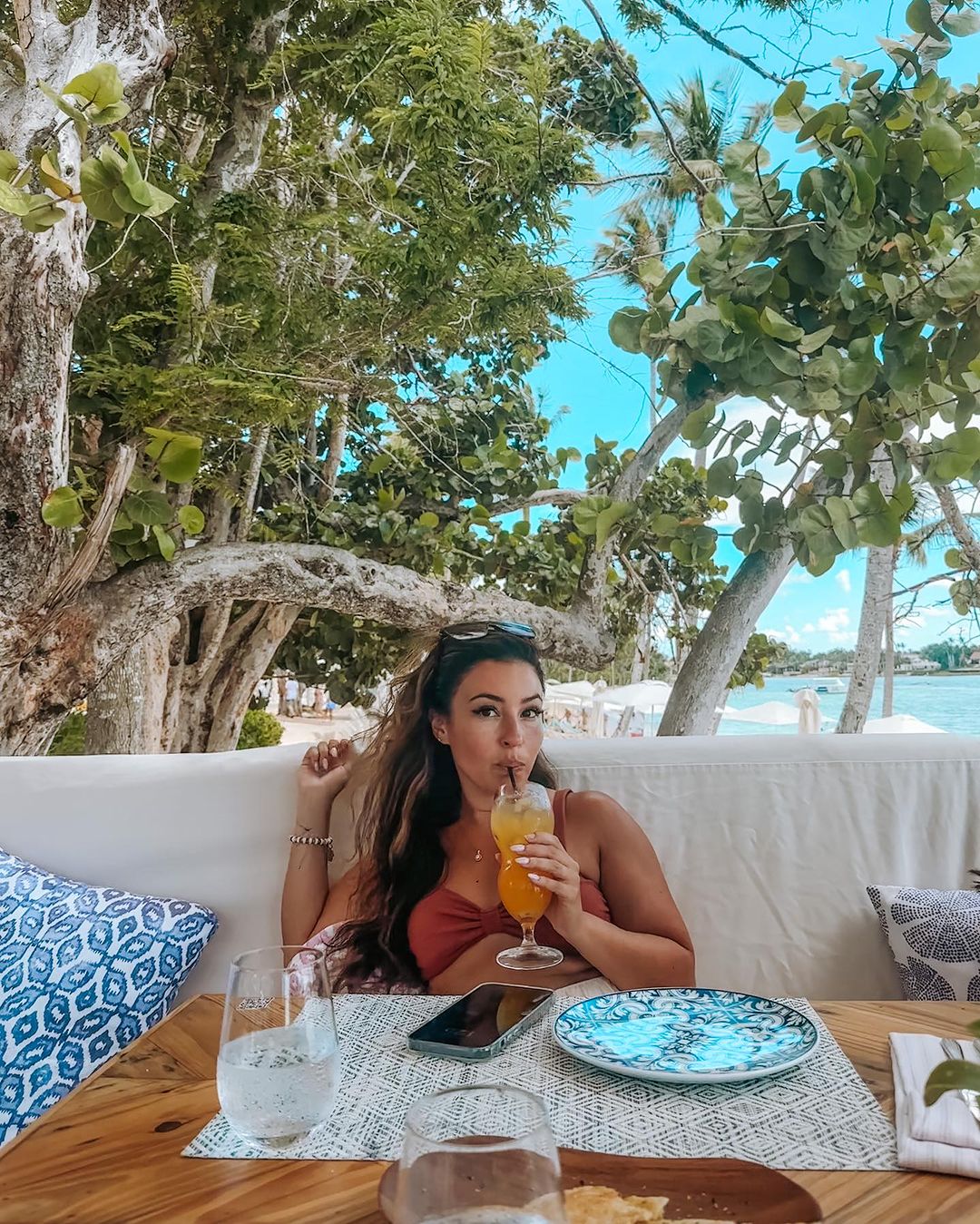 Woman with drink at Minitas Beach Club & Restaurant