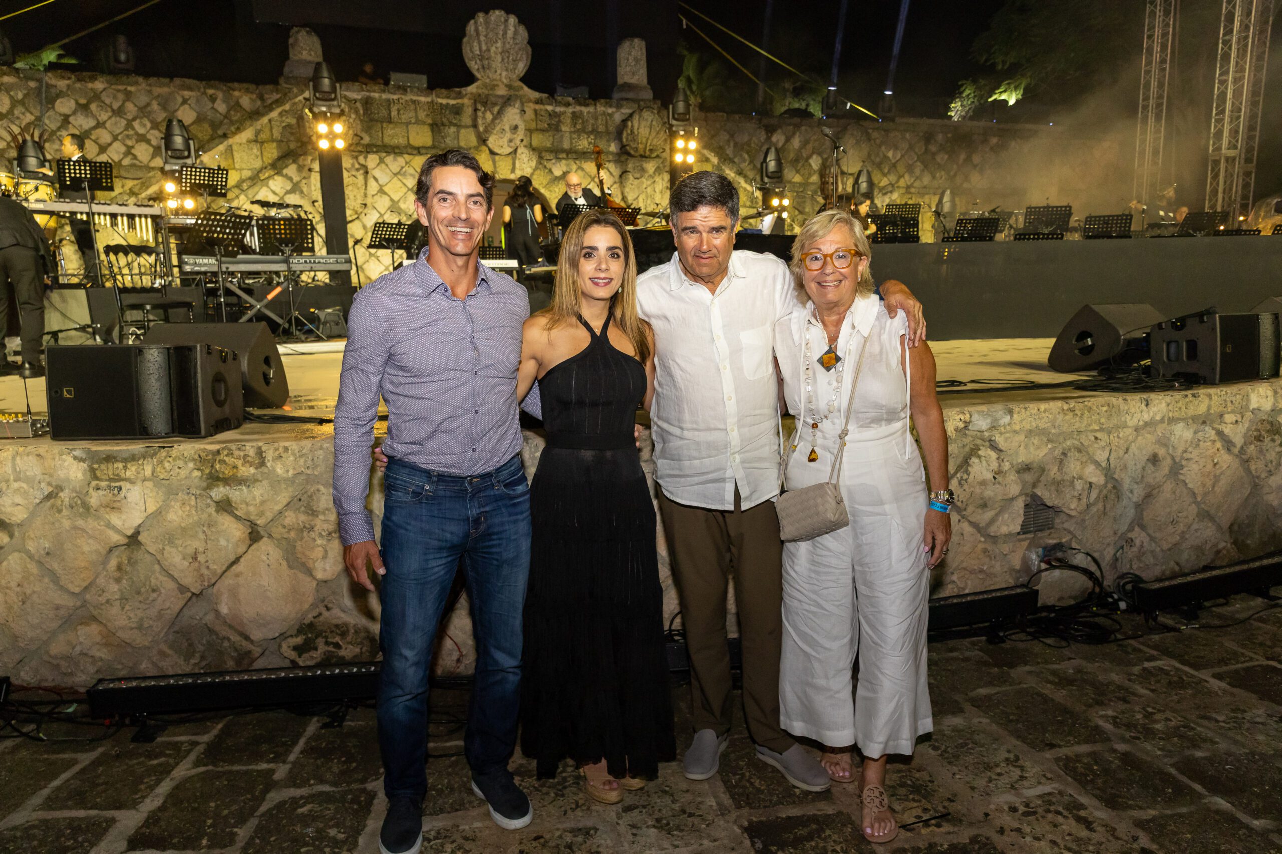 A group of concert goers smiling at our Dominican Republic event venue