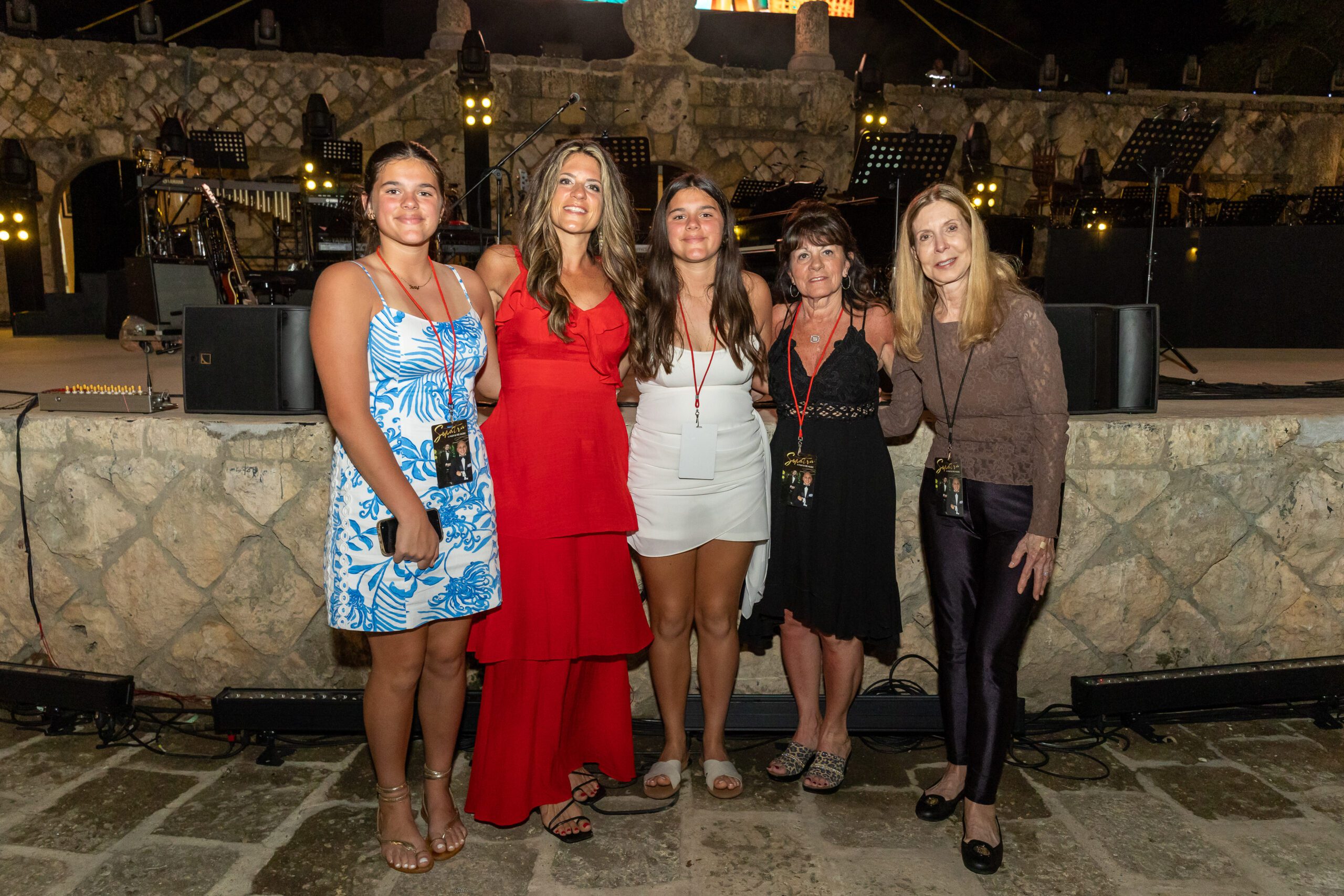 A group of guests posing together at the 50th anniversary concert at our Caribbean event venue
