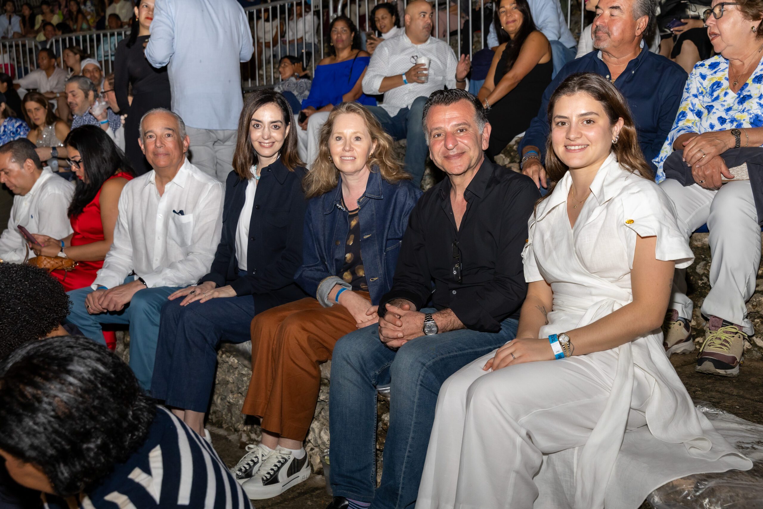 Concert goers smiling for a photo at the concert venue at our La Romana golf resort