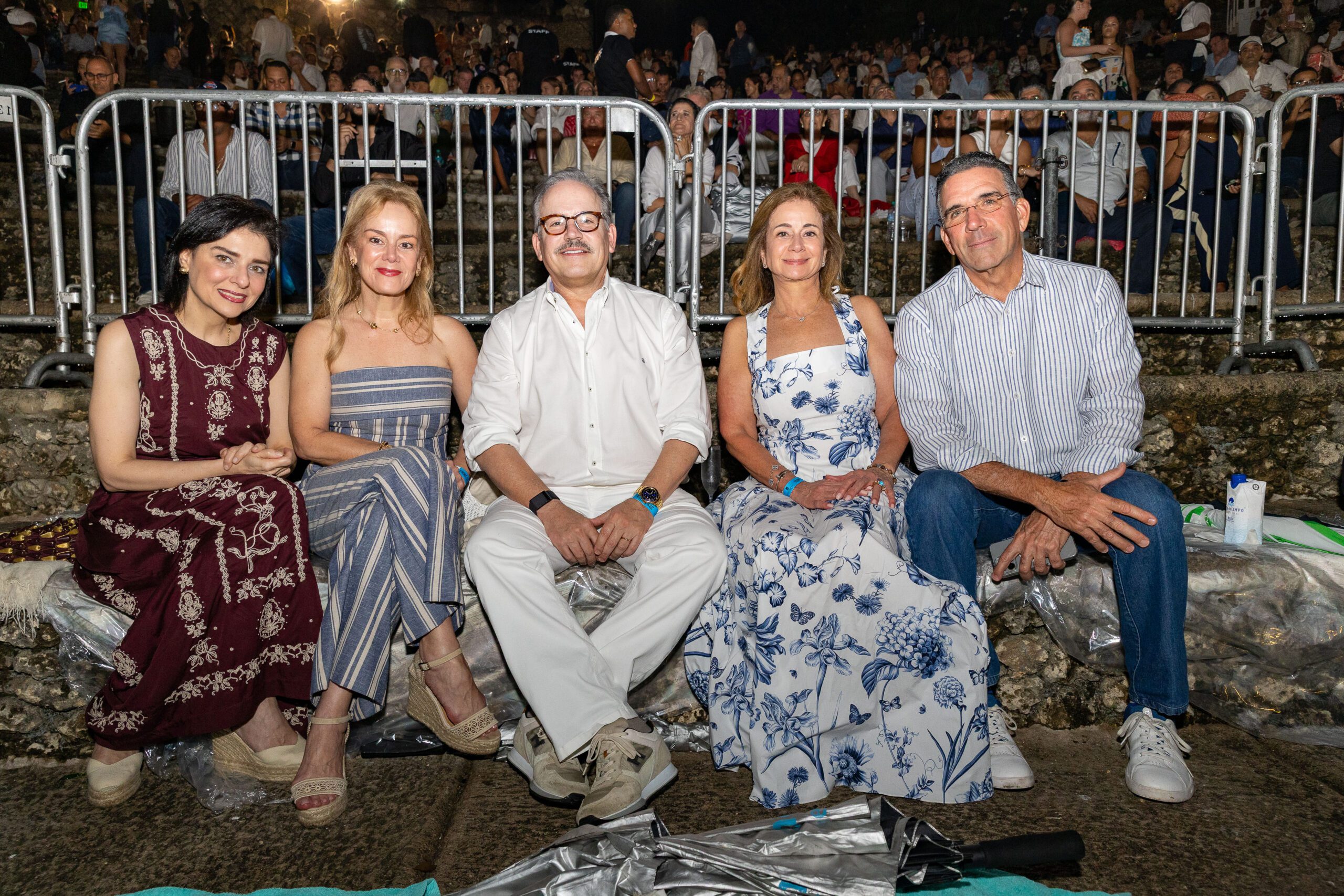A group posing for a photo at a concert at our Dominican Republic luxury resort