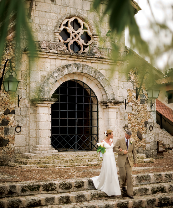 A bride walking down the aisle at her Casa de Campo wedding reception